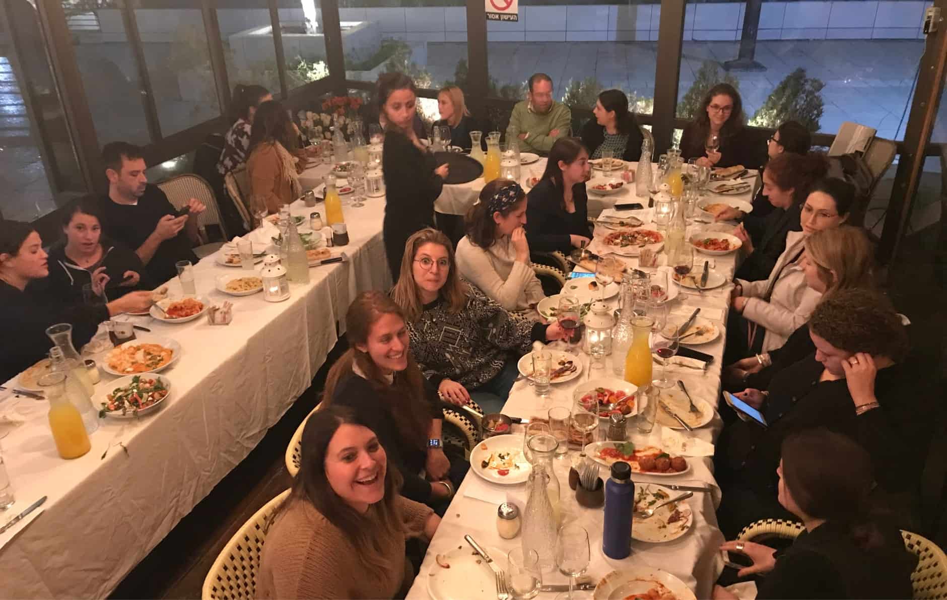 Image of students and professors having dinner together