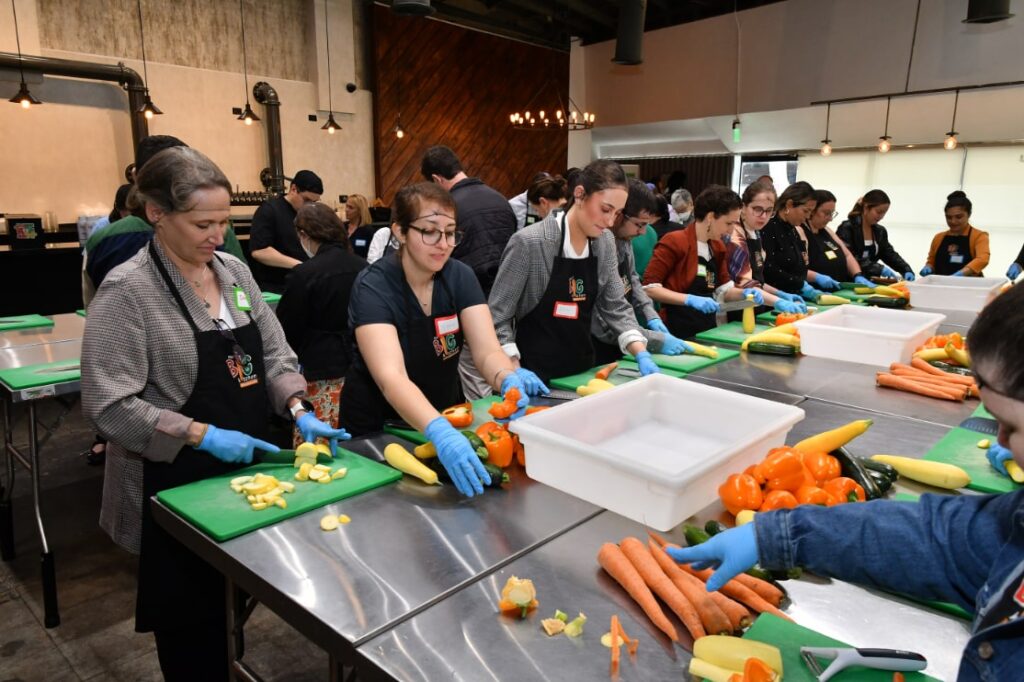 Everyone chopping up vegetables at our big kitchen